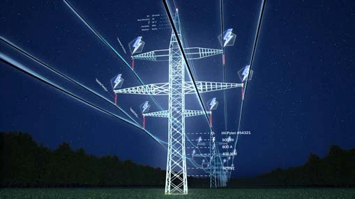 Electrical transmission towers and power lines at night