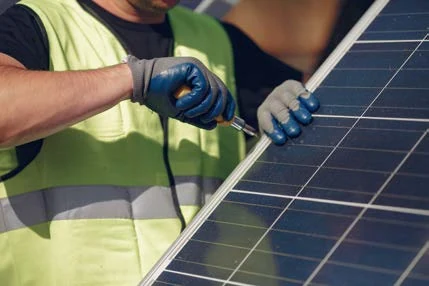 Technician working on a solar panel
